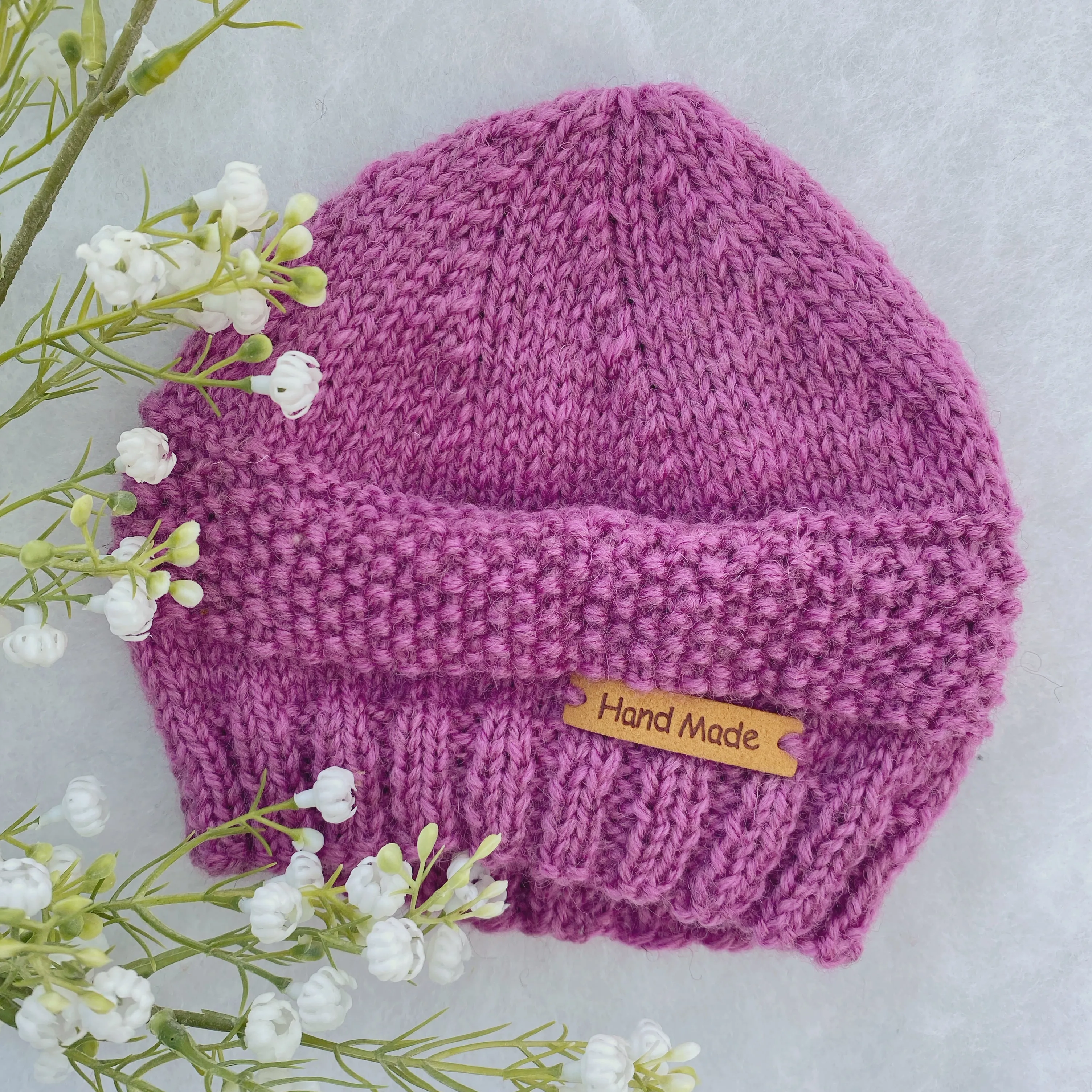 Assorted merino baby beanies and hats