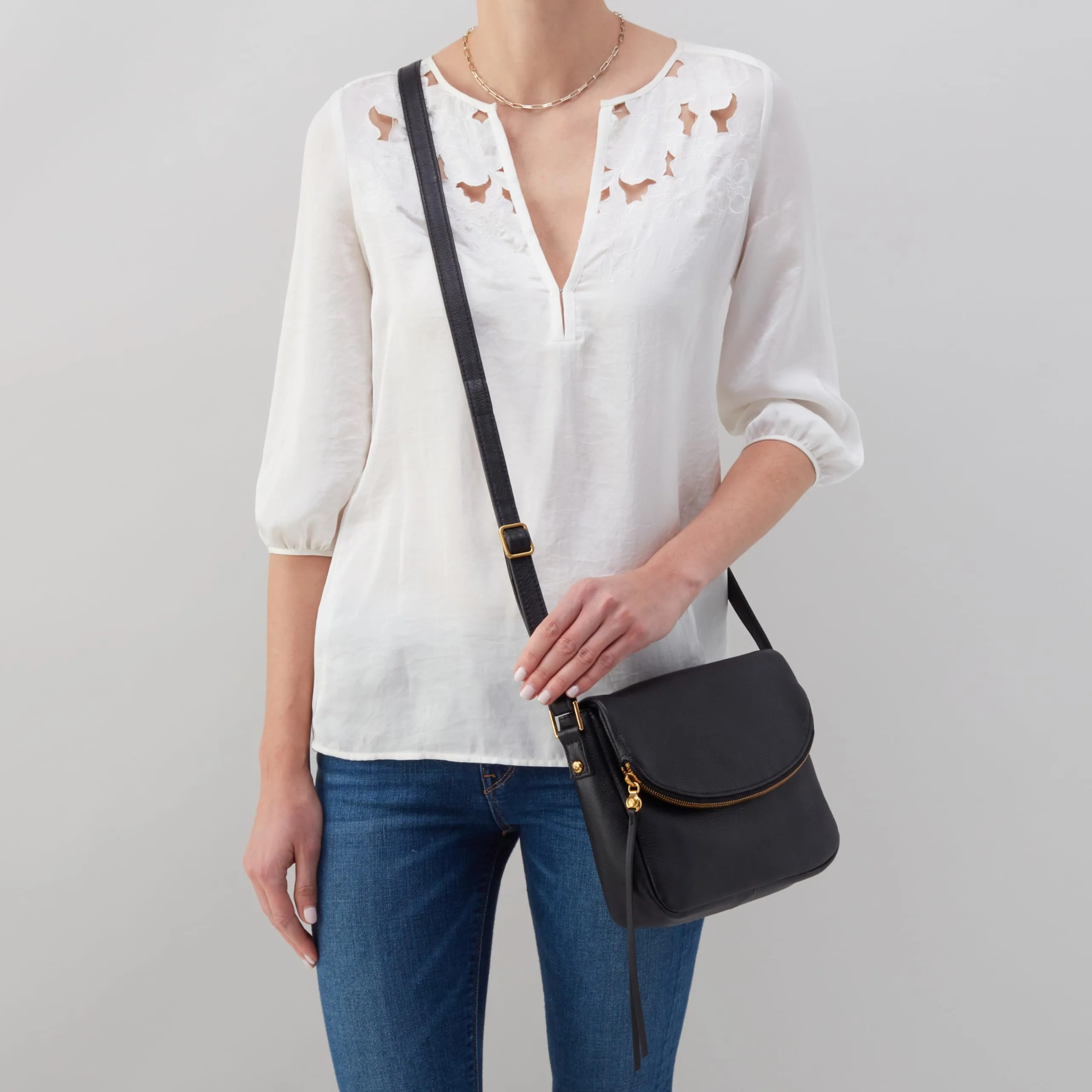 HOBO Fern Leather Messenger Crossbody Bag with Two Interior Compartments, an Adjustable Strap, Zip Security, and Unique Hidden Magnet Flap Closure, Black